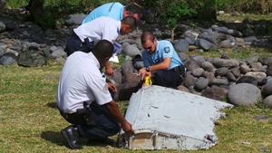 Malaysian investigators probe plane debris for MH370 link